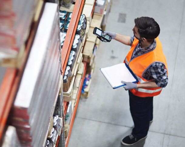 Man Scanning Products in Warehouse